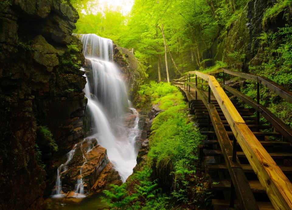<p>In the midst of New Hampshire's White Mountains you can visit the Flume gorge to see waterfalls cut through the granite walls. </p>