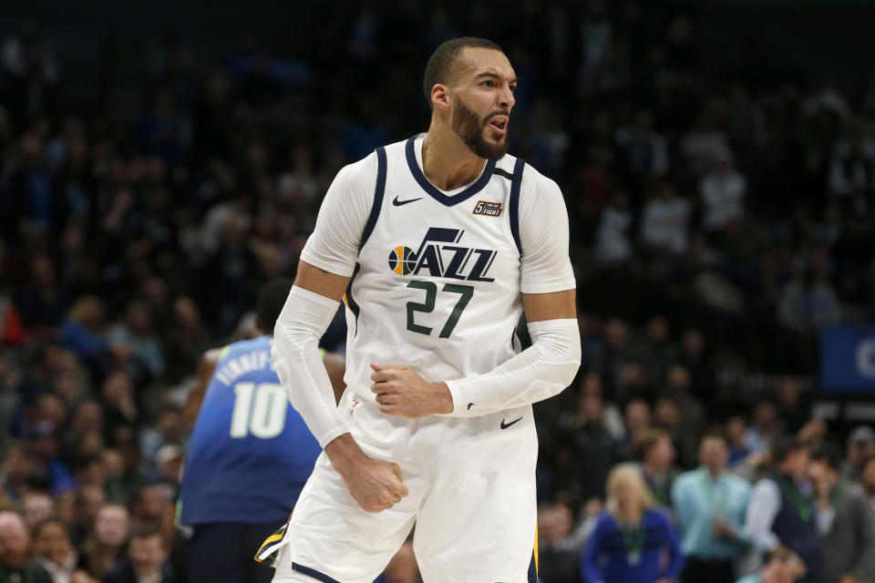 Utah Jazz center Rudy Gobert (27) celebrates a dunk against the Dallas Mavericks during the second half an NBA basketball game in Dallas, Monday, Feb. 10, 2020. (AP Photo/Michael Ainsworth)