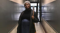 This Feb 1, 2020 photo provided Maureen Nicol shows her in Harlem, N.Y. Nicol, a single Columbia University PhD student pregnant with her first child, will be giving birth out of state, not as planned. She spent months planning to give birth in April at a Manhattan hospital with the assistance of a doula. But during a visit this month to her family's Maryland home, New York became the nation's coronavirus epicenter and she canceled plans to return. (Courtesy of Maureen Nicol via AP)