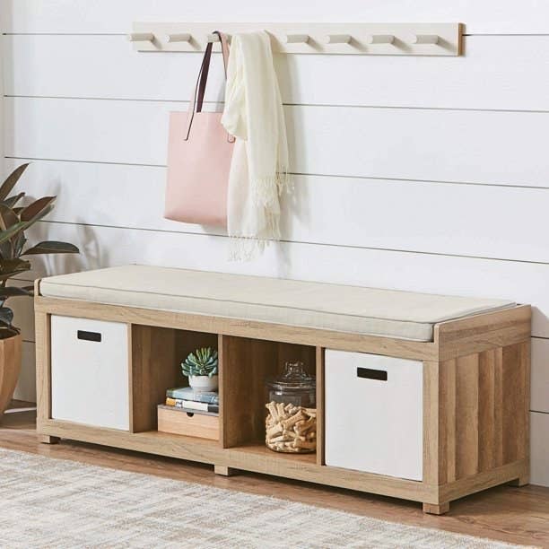 The four-cube bench in brown with two white storage cubes in it