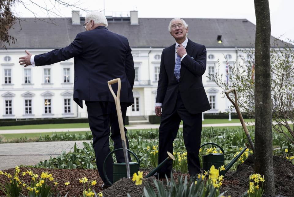 FILE - Britain's King Charles III, right, reacts beside German President Frank-Walter Steinmeier after the planted a tree in the garden of the presidential Bellevue Palace in Berlin, on March 29, 2023. King Charles III won plenty of hearts during his three-day visit to Germany, his first foreign trip since becoming king following the death of his mother, Elizabeth II, last year. (Jens Schlueter/Pool via AP, File)