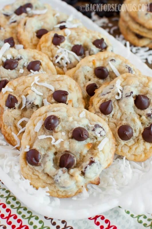 <p>backforseconds.com</p><p>These soft and chewy Coconut Chocolate Chip Cookies are a fun, tropical twist on everyone’s favorite cookie! They pair beautifully with a good cup of coffee. </p><p><strong>Get the recipe: </strong><a href="http://backforseconds.com/coconut-chocolate-chip-cookies/" rel="nofollow noopener" target="_blank" data-ylk="slk:Coconut Chocolate Chip Cookies;elm:context_link;itc:0;sec:content-canvas" class="link "><strong>Coconut Chocolate Chip Cookies</strong></a></p>