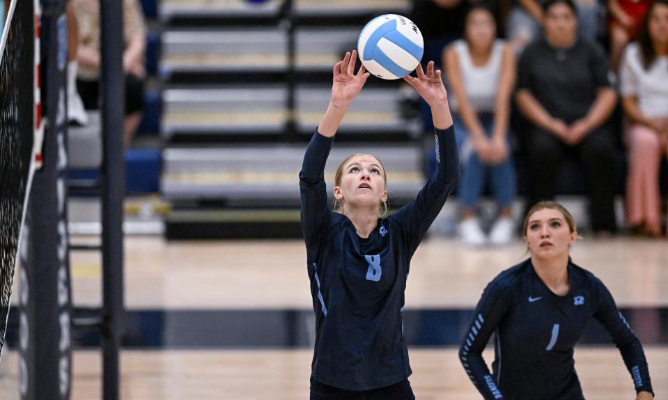 Redwood's Audrey Hyde sets against Frontier in a non-league high school volleyball match Tuesday, August 22, 2023.