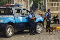 Policemen stand guard outside the Cathedral in Managua, Nicaragua, Saturday, Aug. 13, 2022. The Catholic Church called on faithful to peacefully arrive at the Cathedral in Managua Saturday after National Police denied permission for a planned religious procession on “internal security” grounds. (AP Photo)