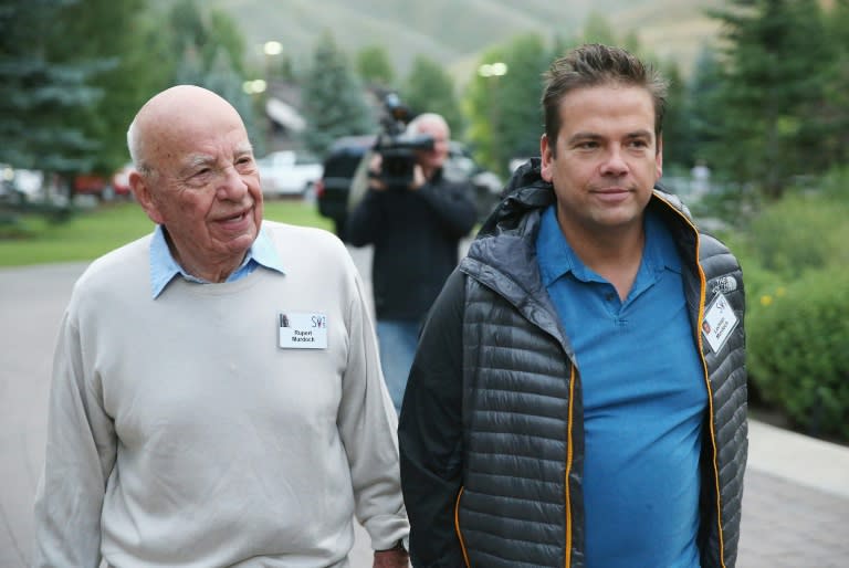 Lachlan Murdoch, who shares the title of executive chairman of 21st Century Fox with his father Rupert Murdoch (L), has said the company is committed to a deal to sell key assets to Walt Disney Co