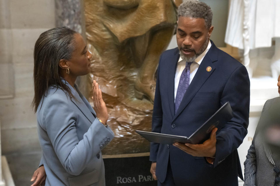 Sen. Laphonza Butler, D-Calif., left, is sworn into the Congressional Black Caucus by Rep. Steven Horsford, D-Nev., right, in front of a statue of Rosa Parks in the Hall of Statuary on Capitol Hill, Tuesday, Oct. 3, 2023 in Washington. (AP Photo/Mark Schiefelbein)