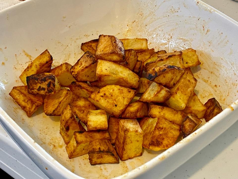 cooked air fryer homefries in white bowl