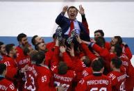 Ice Hockey - Pyeongchang 2018 Winter Olympics - Men Final Match - Olympic Athletes from Russia v Germany - Gangneung Hockey Centre, Gangneung, South Korea - February 25, 2018 - Olympic Athlete from Russia coach Oleg Znarok is lifted up. REUTERS/Brian Snyder