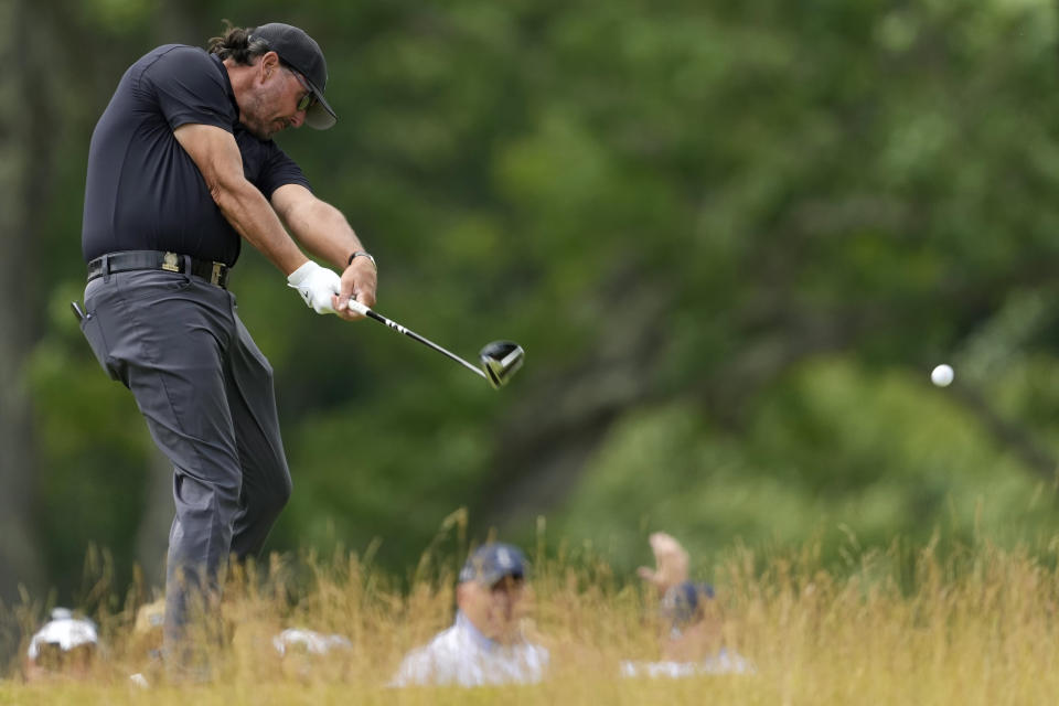 Phil Mickelson hits on the fourth hole during the first round of the U.S. Open golf tournament at The Country Club, Thursday, June 16, 2022, in Brookline, Mass. (AP Photo/Robert F. Bukaty)