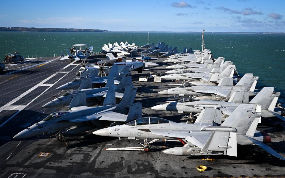 F-18 jet fighters are seen on the flight deck of USS Gerald R. Ford, on November 17, 2022 in Gosport, England.