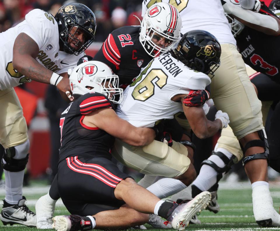 Utah Utes linebacker Karene Reid (21) and Utah Utes defensive end Van Fillinger (7) sack Colorado Buffaloes quarterback Ryan Staub (16) in Salt Lake City on Saturday, Nov. 25, 2023. Utah won 23-17. | Jeffrey D. Allred, Deseret News