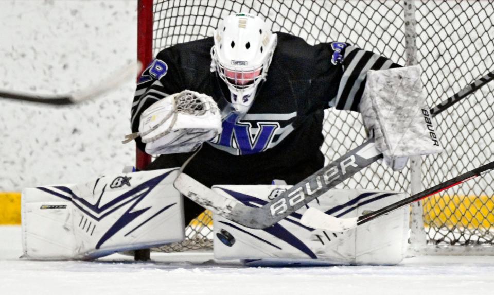 Martha's Vineyard goalie Zach Mathias deflects a Sandwich shot on Feb. 15, 2023.