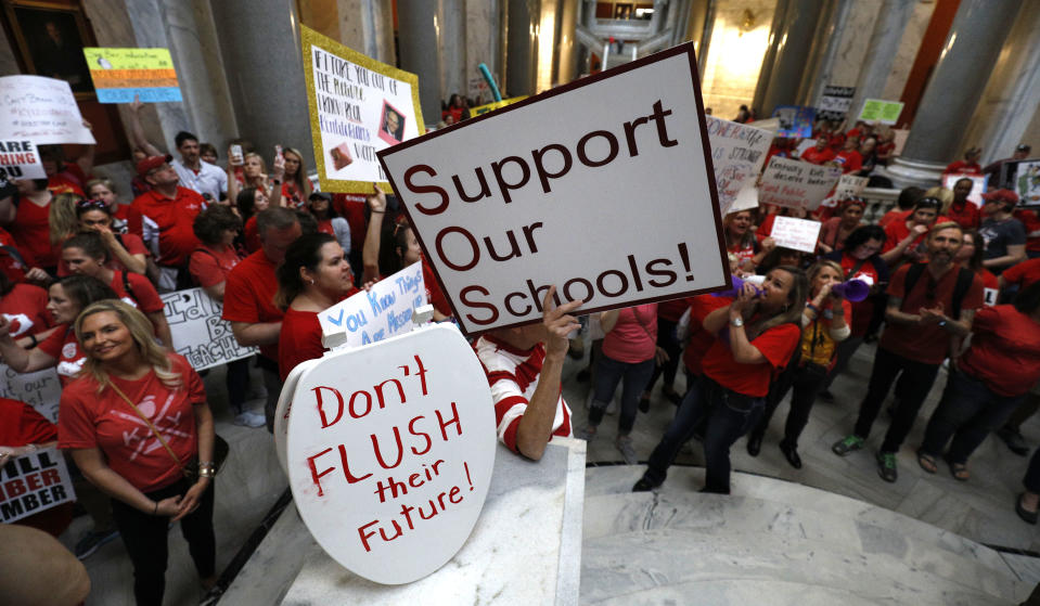 <p>Teachers from across Kentucky gather inside the state Capitol to rally for increased funding for education, Friday, April 13, 2018, in Frankfort, Ky. (Photo: Bryan Woolston/AP) </p>