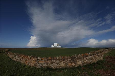 A dry stone wall surrounds a field outside Torness nuclear power station in Dunbar, Scotland May 13, 2013. REUTERS/Suzanne Plunkett