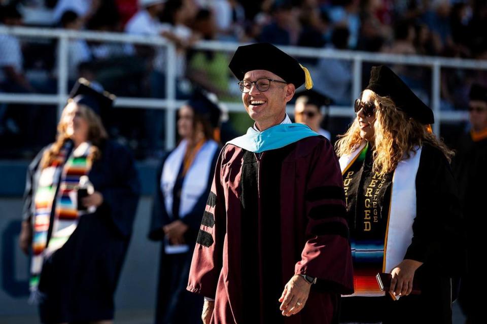 Merced College President Chris Vitelli leads dignitaries and faculty onto Don Odishoo Field at Stadium ’76 during a commencement ceremony for the Merced College class of 2022 in Merced, Calif., on Friday, May 20, 2022.