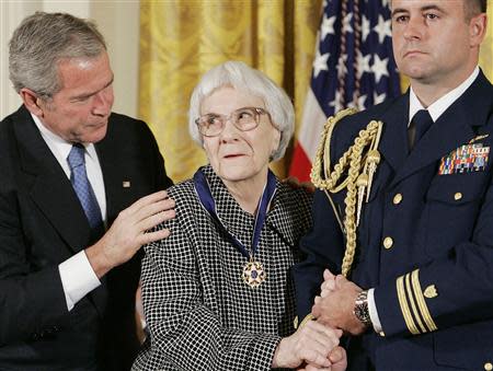 U.S. President George W. Bush (L) awards the Presidential Medal of Freedom to American novelist Harper Lee (C) in the East Room of the White House, in this file photo from November 5, 2007. The Monroe County Heritage Museum, which honors the hometown author of "To Kill a Mockingbird," is hitting back over a lawsuit by Lee accusing it of exploiting one of America's best-loved books. REUTERS/Larry Downing/Files