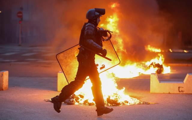 Riot police on the streets of Strasbourg - AP Photo/Jean-Francois Badias