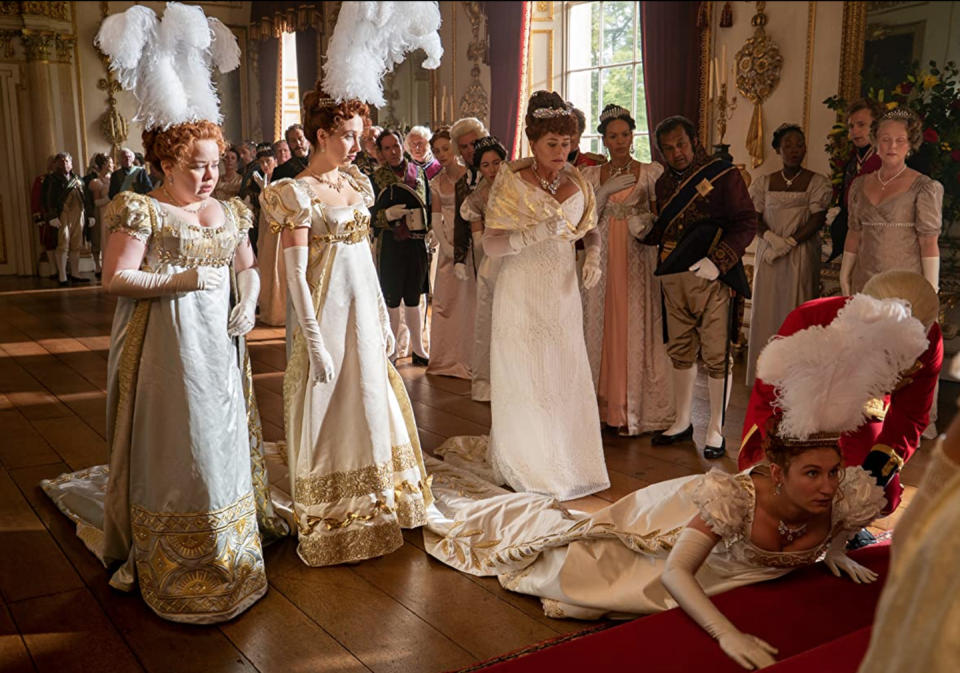 <p>Being presented to the Queen at the start of London's social season is essentially the same thing as high school prom, just during the Regency era. Penelope Featherington stunned in an empire waist evening gown with gold embroidery for her debut. </p><p><a class="link " href="https://www.netflix.com/title/80232398" rel="nofollow noopener" target="_blank" data-ylk="slk:STREAM NOW;elm:context_link;itc:0;sec:content-canvas">STREAM NOW</a></p>