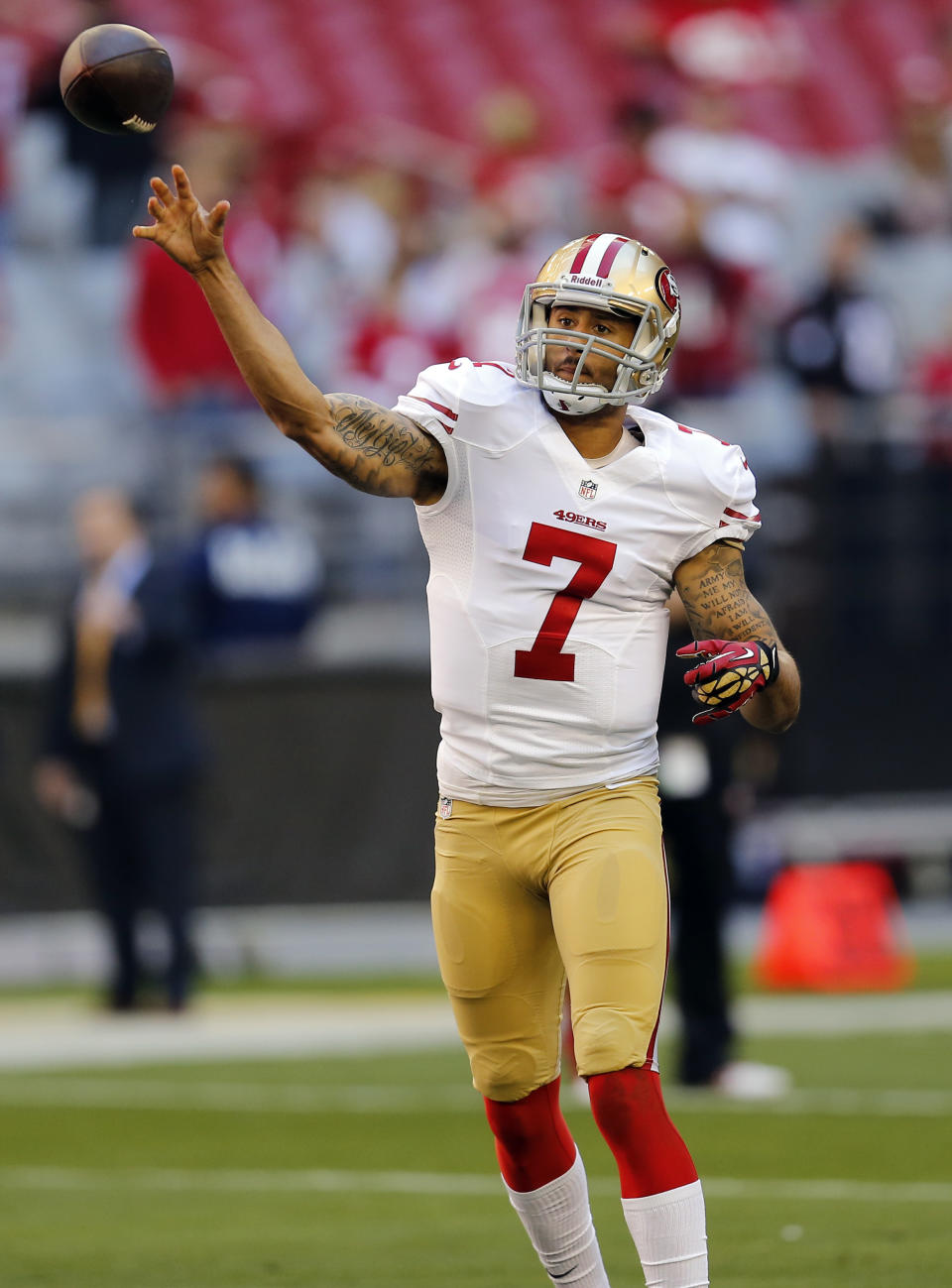 San Francisco 49ers quarterback Colin Kaepernick (7) warms up before an NFL football game against the Arizona Cardinals, Sunday, Dec. 29, 2013, in Glendale, Ariz. (AP Photo/Matt York)