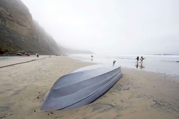 PHOTO: A boat sits overturned on Blacks Beach, March 12, 2023, in San Diego. (Gregory Bull/AP)