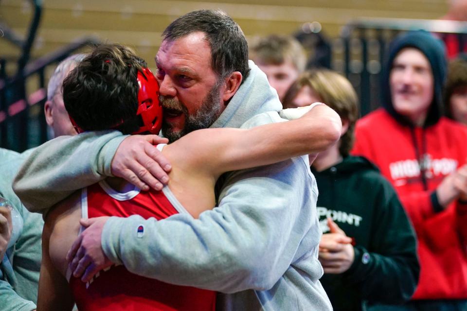 High Point head wrestling coach John Gardner, right, hugs Roman Citro after winning his 126-pound bout to win the team state final over Governor Livingston at Jersey Mike's Arena in Piscataway on Sunday, Feb. 12, 2023.