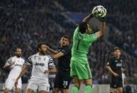 Soccer Football - FC Porto v Juventus - UEFA Champions League Round of 16 First Leg - Dragao Stadium, Porto, Portugal - 22/2/17 Juventus' Gianluigi Buffon in action as FC Porto's Tiquinho Soares looks on Reuters / Rafael Marchante Livepic