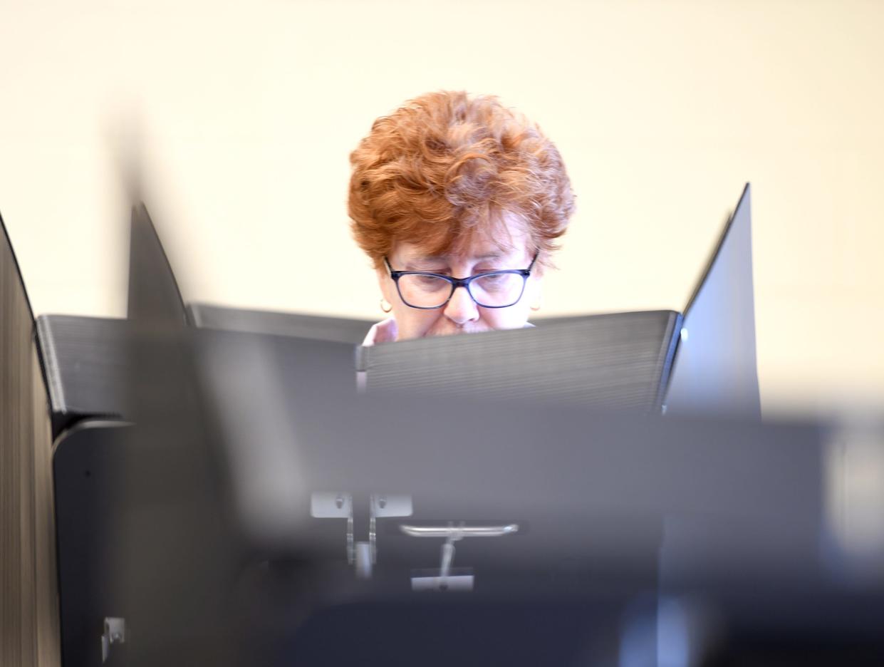 Gretchen DelSavio of Louisville votes in this file photo from July at the Stark County Board of Elections.