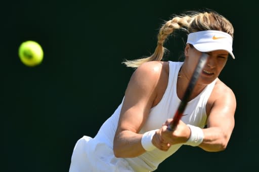 Canada's Eugenie Bouchard returns against Britain's Gabriella Taylor