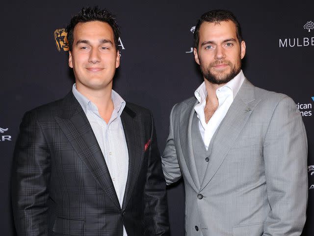 <p>AFF / Alamy</p> Henry Cavill & Charlie Cavill arriving for the BAFTA Los Angeles Tea Party in 2015