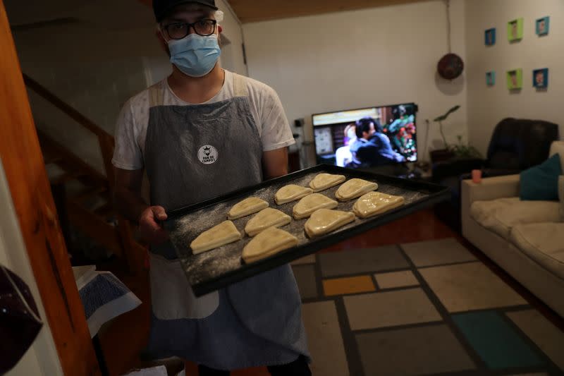 Pedro Campos bakes and sells homemade bread to his neighbours at Puente Alto area in the outskirt of Santiago