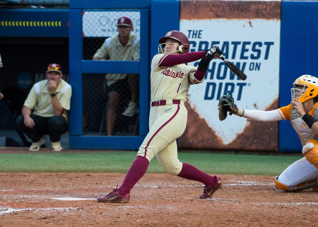 Jun 5, 2023; Oklahoma City, OK, USA; Florida State Seminoles outfielder Hallie Wacaser (1) hits a home run in the sixth inning against the Tennessee Lady Vols during the semifinal game at OGE Energy Field at the USA Softball Hall of Fame Complex. Mandatory Credit: Brett Rojo-USA TODAY Sports