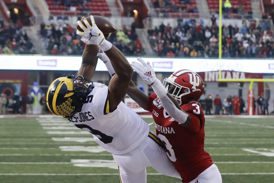 Michigan wide receiver Donovan Peoples-Jones (9) makes a touchdown reception against Indiana defensive back Tiawan Mullen (3) during the first half of an NCAA college football game, Saturday, Nov. 23, 2019, in Bloomington, Ind. (AP Photo/Darron Cummings)