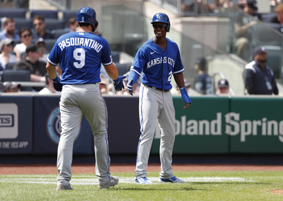 Kansas City Royals' Vinnie Pasquantino (9) and Michael A. Taylor (2) celebrate after scoring against the New York Yankees during the fifth inning of a baseball game Sunday, July 31, 2022, in New York. (AP Photo/Noah K. Murray)