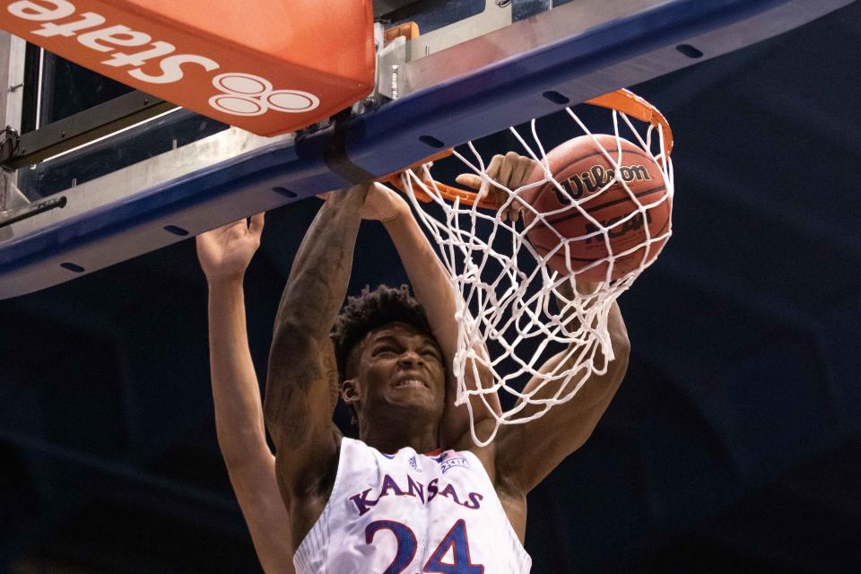 Kansas forward KJ Adams Jr. (24) slams home a dunk against Iowa State. Kansas won the game 62-61 in January at Allen Fieldhouse.