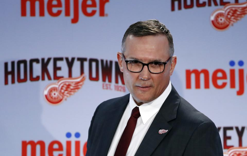 Steve Yzerman walks into the news conference where he was introduced as the new executive vice president and general manager of the Detroit Red Wings NHL hockey club, Friday, April 19, 2019, in Detroit. Yzerman returns to Detroit where he was part of three Stanley Cup championship teams and a captain. (AP Photo/Carlos Osorio)