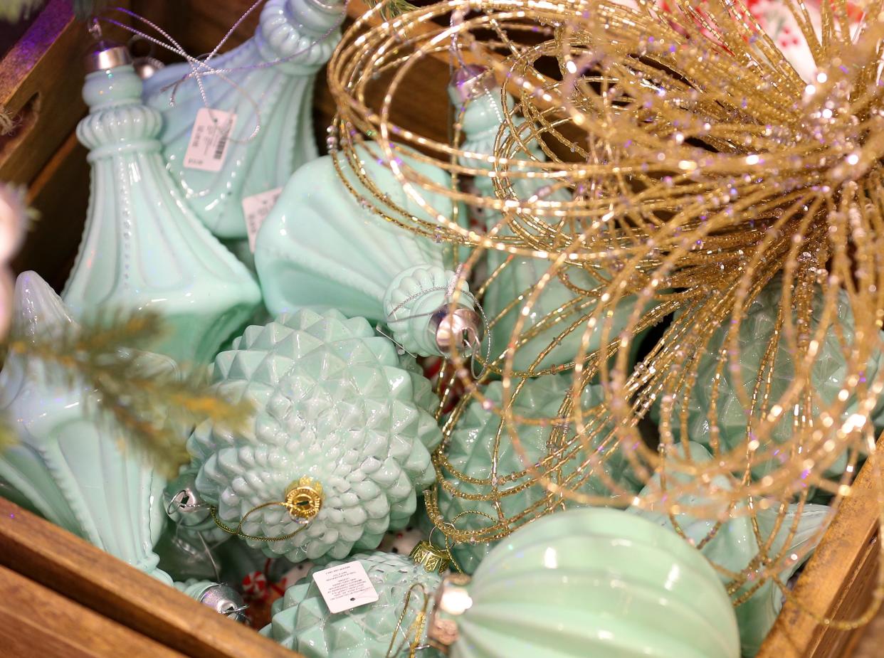 Paring the colors sage and gold is a top decorating trend for Christmas 2022. Dillard's Home Store Mall St. Matthews