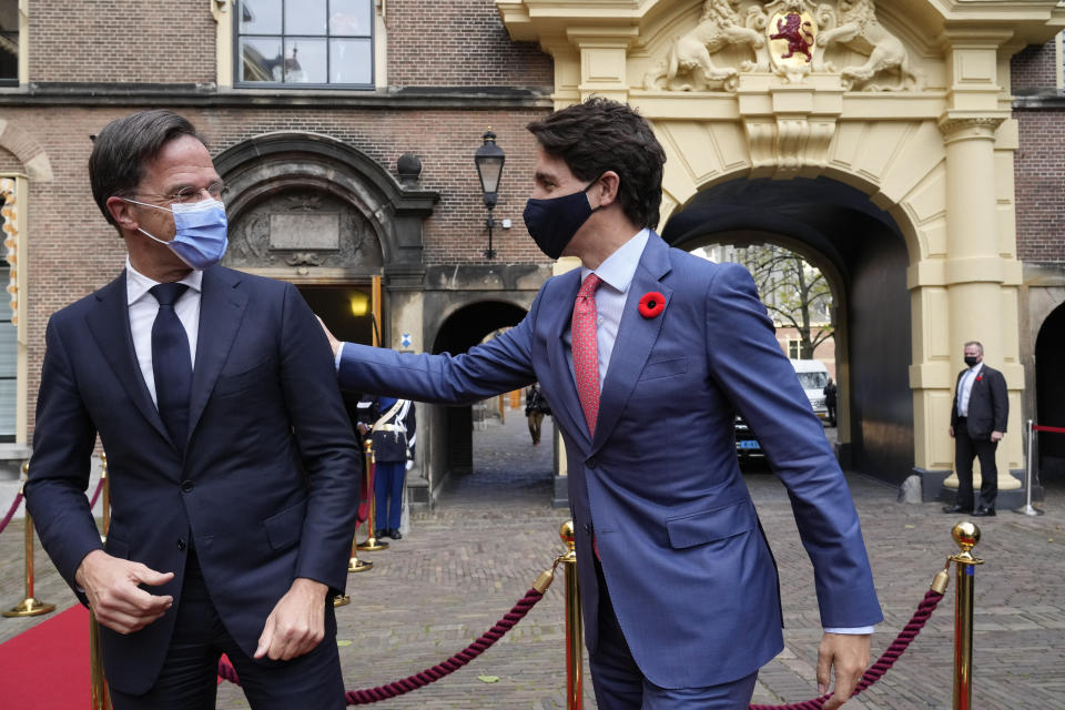 Canada's Prime Minister Justin Trudeau, right, and Dutch caretaker Prime Minister Mark Rutte, greet prior to a meeting in The Hague, Netherlands, Friday, Oct. 29, 2021. (AP Photo/Peter Dejong)