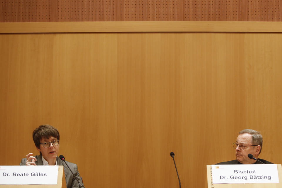 Beate Gilles, left, Secretary General of the German Bishops' Conference, flanked by chairman, Monsignor Georg Baetzing, speaks during a press conference at the end of a 6-day visit of German bishops to the Vatican, including an audience with Pope Francis, in Rome, Saturday, Nov. 19, 2022. Top Vatican cardinals tried to put the brakes on the German Catholic Church's controversial reform process Friday, fearing proposals concerning gays, women and sexual morals will split the church and insisting they would be better debated later. (AP Photo/Riccardo De Luca)