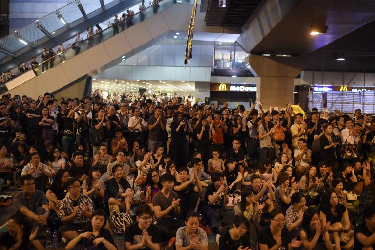 Pro-democracy supporters gather for a rally after the government called off talks with protest leaders, in Hong Kong, on October 10, 2014