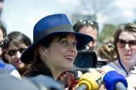 French actress Marion Cotillard talks to the media after a ceremony with French President Francois Hollande in Manila on February 26, 2015