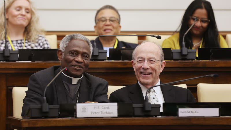 Cardinal Peter Turkson, chancellor of the Pontifical Academy of Sciences and the Social Sciences, and Keith B. McMullin, CEO of Deseret Management Corp. and a former member of the Presiding Bishopric of The Church of Jesus Christ of Latter-day Saints, participate in the Symposium on the Role of News, Media and Art in Society at the Vatican on Thursday, May 11, 2023.