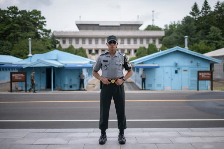 A South Korean soldier stands on the other side of the military demarcation line at the truce village of Panmunjom