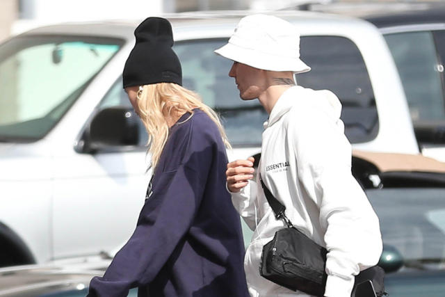 hailey baldwin and justin bieber are all smiles while justin shows off his  louis vuitton slippers as the couple stepped out in new york city-150219_3