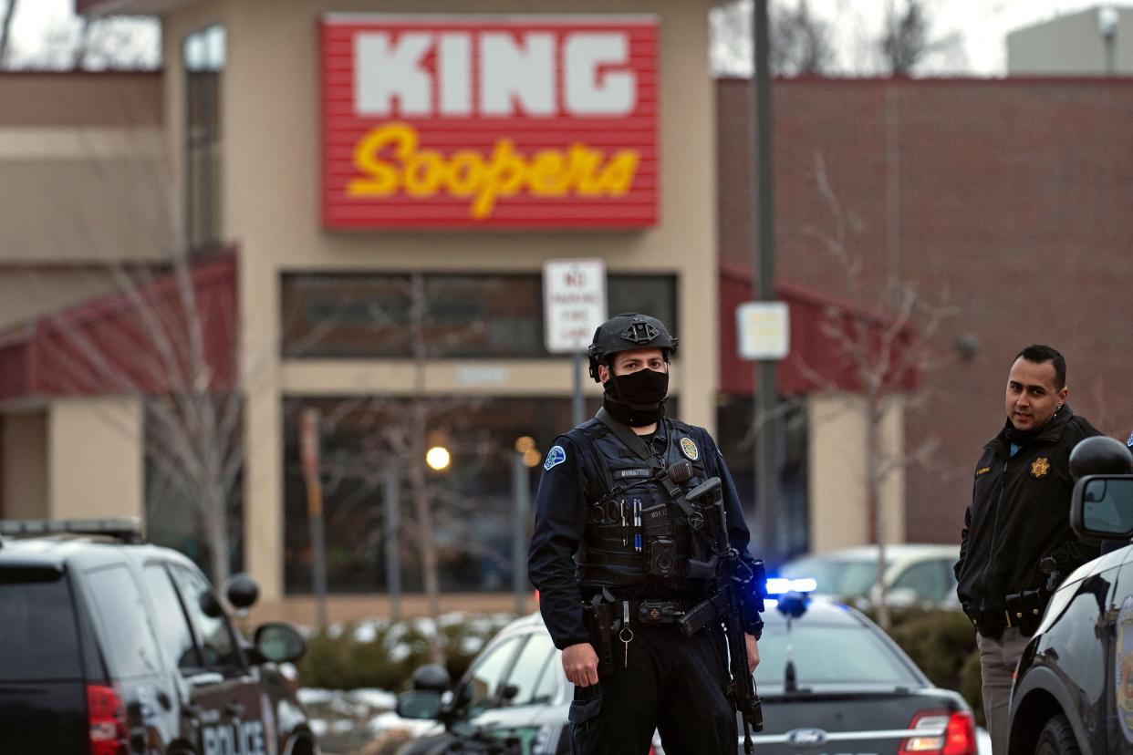 Police officers secure the perimeter of the King Soopers grocery store in Boulder, Colorado on March 22, 2021 after reports of an active shooter.