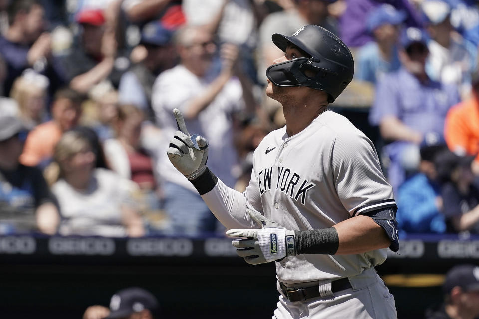 New York Yankees' Aaron Judge celebrates as he crosses the plate after hitting a solo home run during the first inning of a baseball game against the Kansas City Royals Sunday, May 1, 2022, in Kansas City, Mo. (AP Photo/Charlie Riedel)
