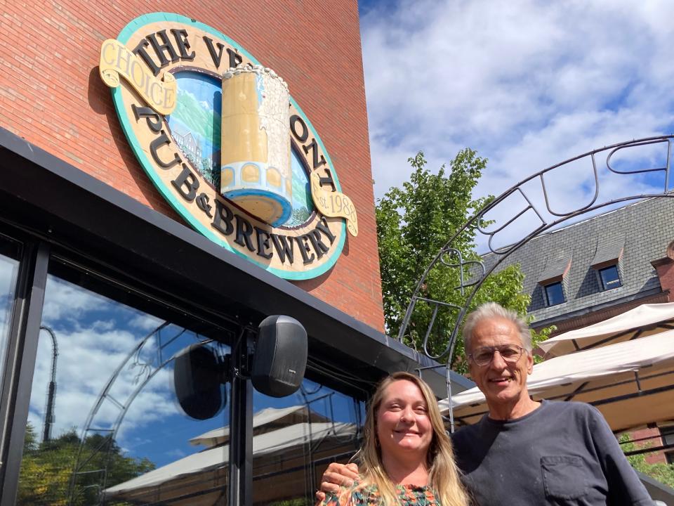 Elise Pecor, owner of The Vermont Pub & Brewery, and co-founder Steve Polewacyk stand on the patio of the Burlington business Sept. 14, 2023.