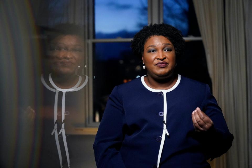 Georgia gubernatorial Democratic candidate Stacey Abrams speaks during an interview with The Associated Press on Thursday, Dec. 16, 2021, in Decatur, Ga