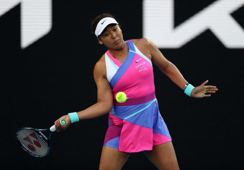 Naomi Osaka hits the ball during a match at the 2022 Australian Open.