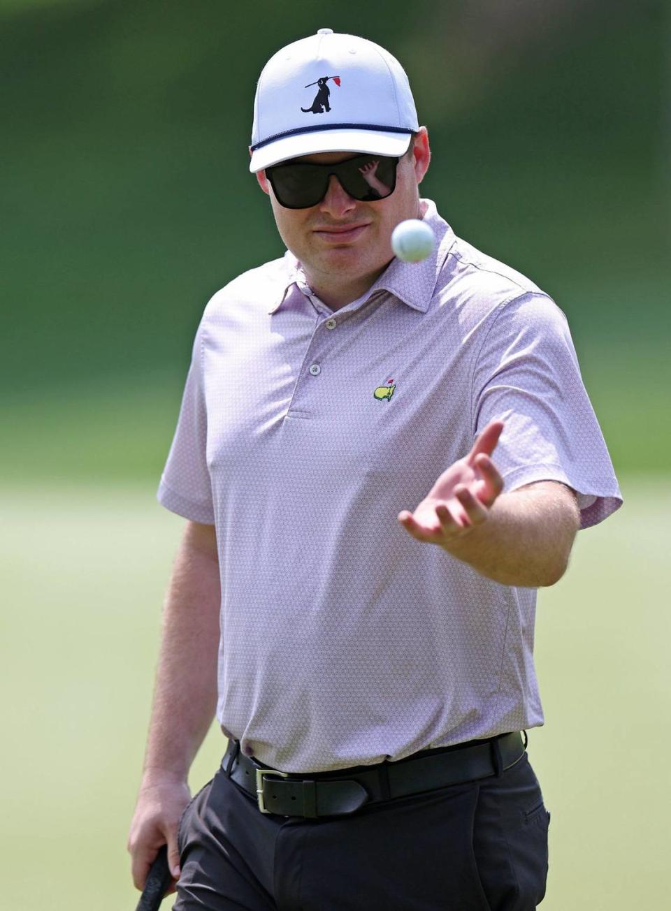 NASCAR Xfinity Series driver Cole Custer reaches out to catch his ball after kicking it up off his putter on the 15th green during the Wells Fargo Championship Pro-Am at Quail Hollow Club on Wednesday, May 8, 2024. JEFF SINER/jsiner@charlotteobserver.com