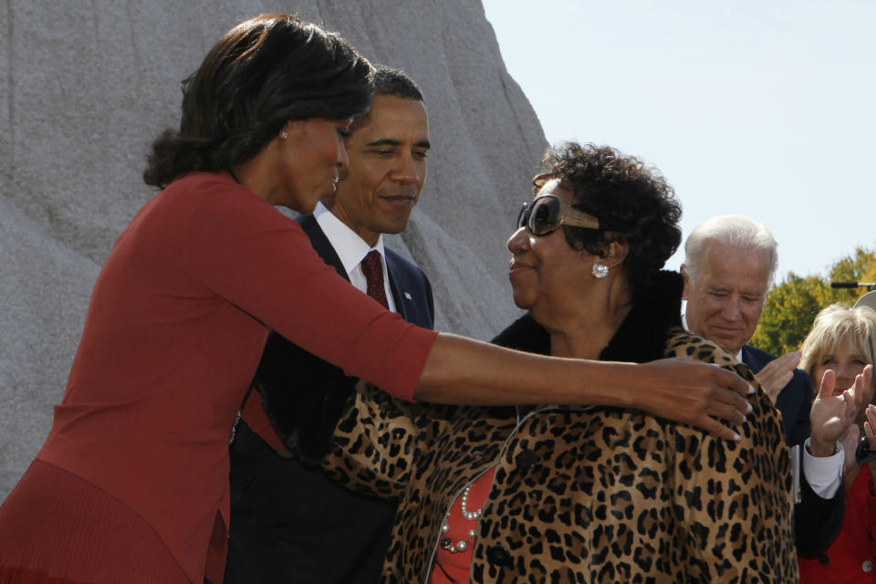 President Barack Obama watches as first lady Michelle Obama thanks singer Aretha Franklin at the dedication ceremony for the Martin Luther King Jr. Memorial in Washington, D.C., in October 2011. (Photo: Larry Downing/Reuters)